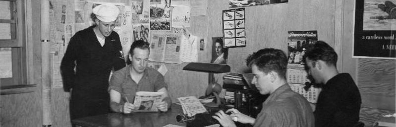 Jack Gordon (at typewriter) and staff aboard NAS Pasco Sky-Writer